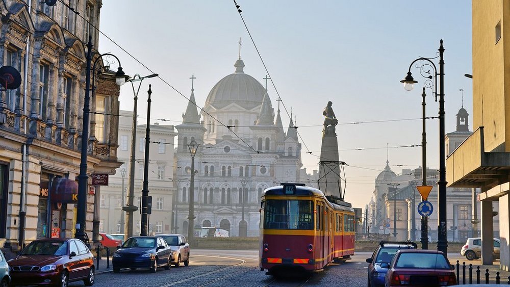 a decorative element: street view with cars and a tram