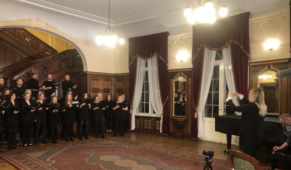 choir performance with a conductor in stylish interiors