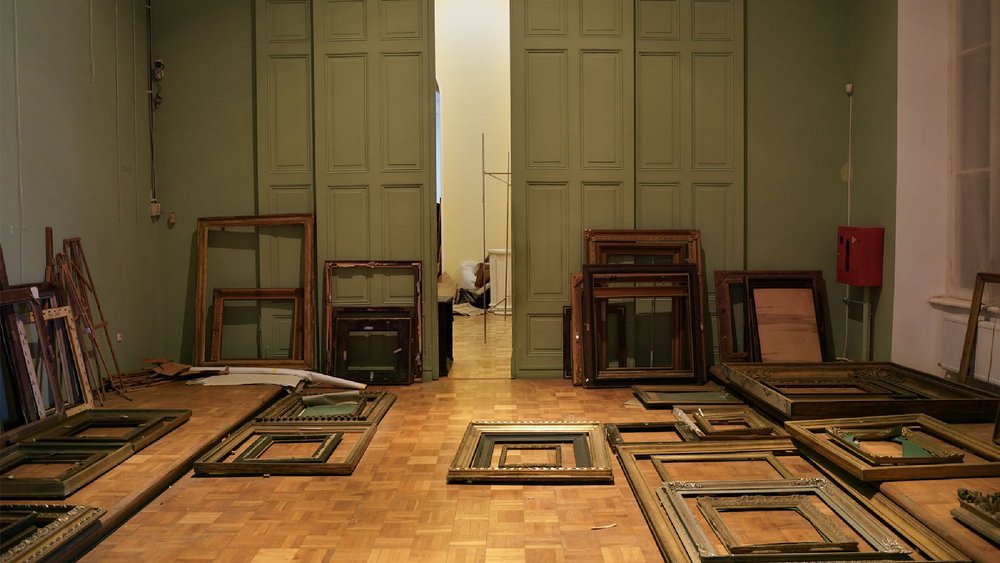 interior of a room with picture frames