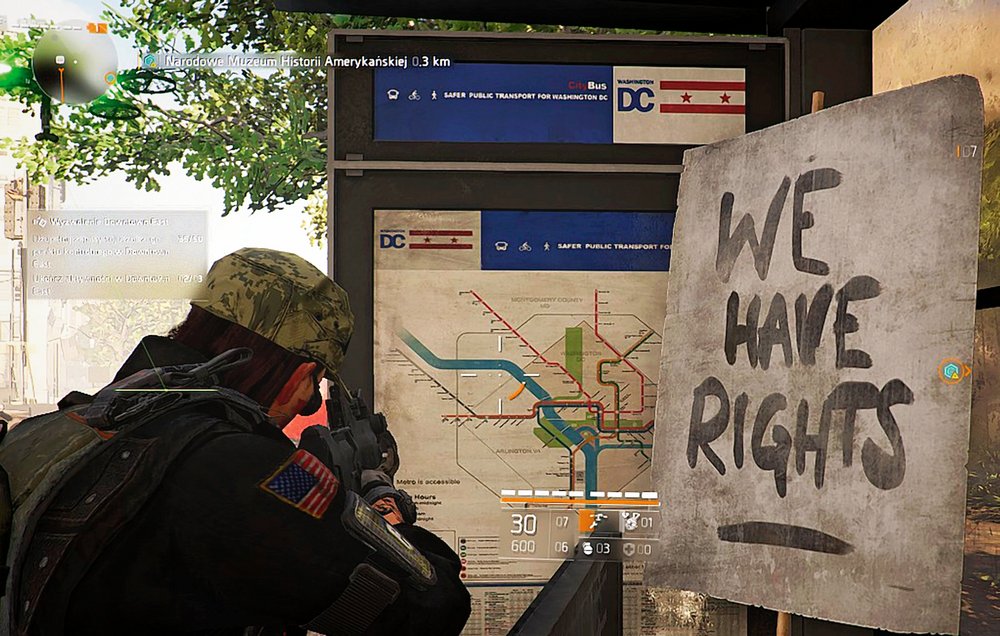An image from the game: a soldier wearing a beret and standing by the subway map: a view from behind his back