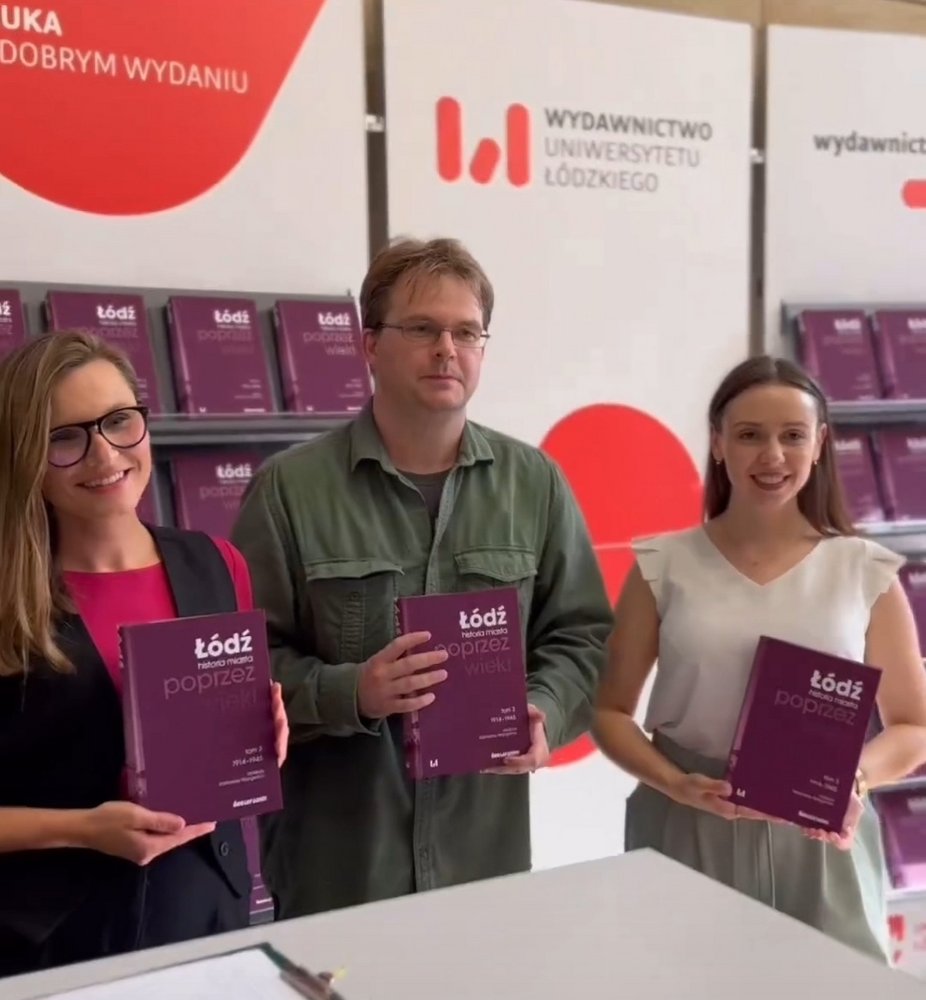 Staff of the Lodz University Press holding books